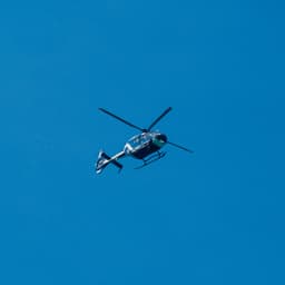 Helicopter in flight illustrating Sabena technics’ aeronautical maintenance operations