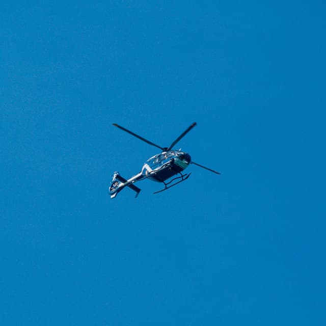 Helicopter in flight illustrating Sabena technics’ aeronautical maintenance operations
